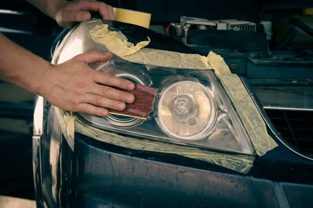 Cleaning car headlights with sandpaper